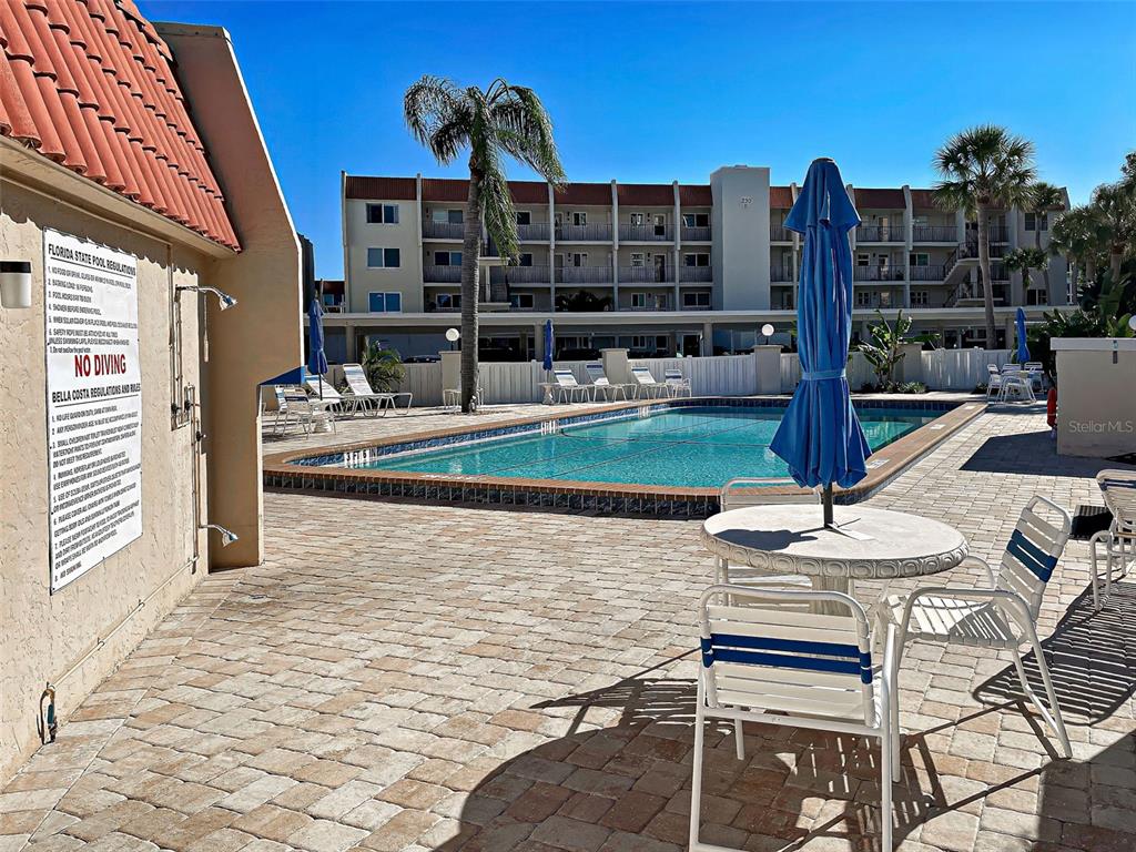 260 Santa Maria Street, Unit 109 Venice, FL 34285 - Photo 42 of 64 a view of swimming pool with outdoor seating and city view