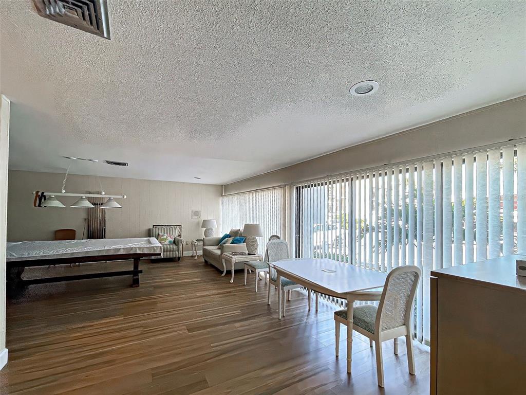 260 Santa Maria Street, Unit 109 Venice, FL 34285 - Photo 47 of 64 a living room with furniture and wooden floor