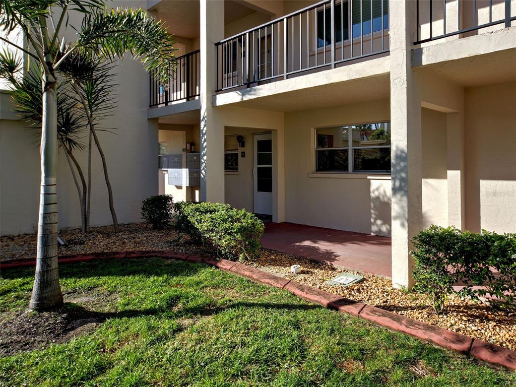 260 Santa Maria Street, Unit 109 Venice, FL 34285 - Photo 49 of 64 a front view of a house with a yard