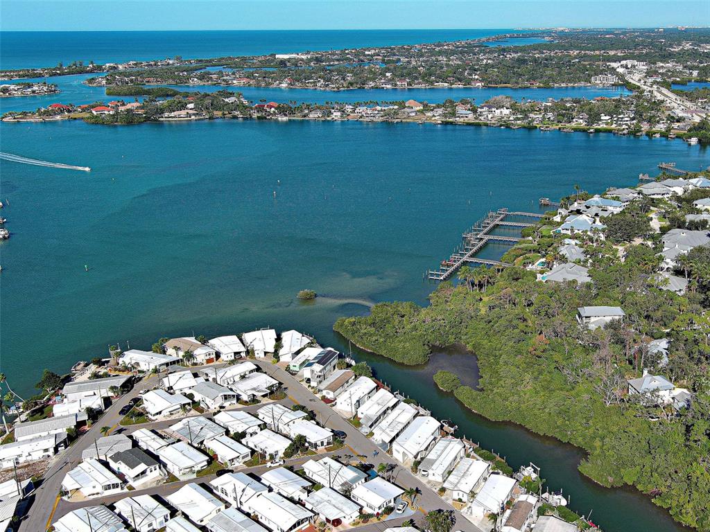 260 Santa Maria Street, Unit 109 Venice, FL 34285 - Photo 50 of 64 an aerial view of a houses with a lake view