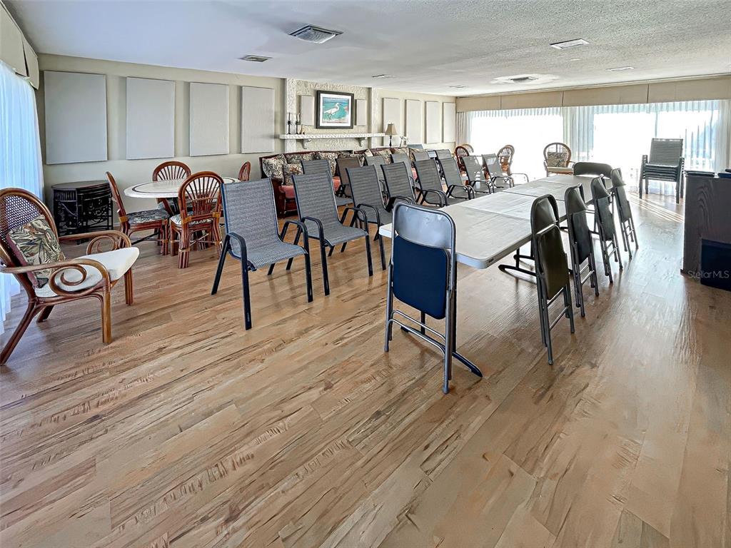 260 Santa Maria Street, Unit 109 Venice, FL 34285 - Photo 51 of 64 a living room with lots of furniture a wooden floor and furniture