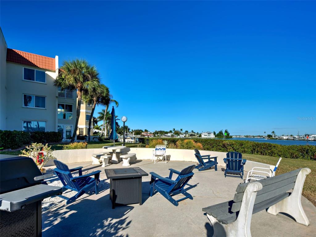 260 Santa Maria Street, Unit 109 Venice, FL 34285 - Photo 62 of 64 a terrace with outdoor seating city view and barbeque oven