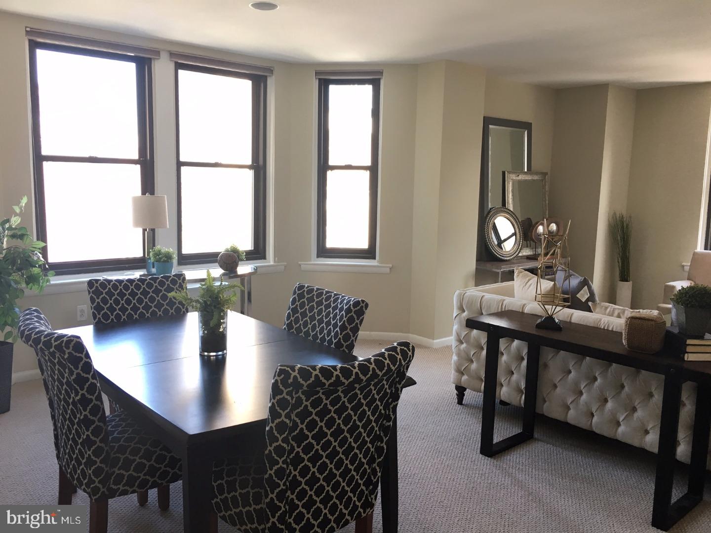 135 South 19th Street, Unit 804 Philadelphia, PA 19103 - Photo 1 of 18 a view of a dining room with furniture and window