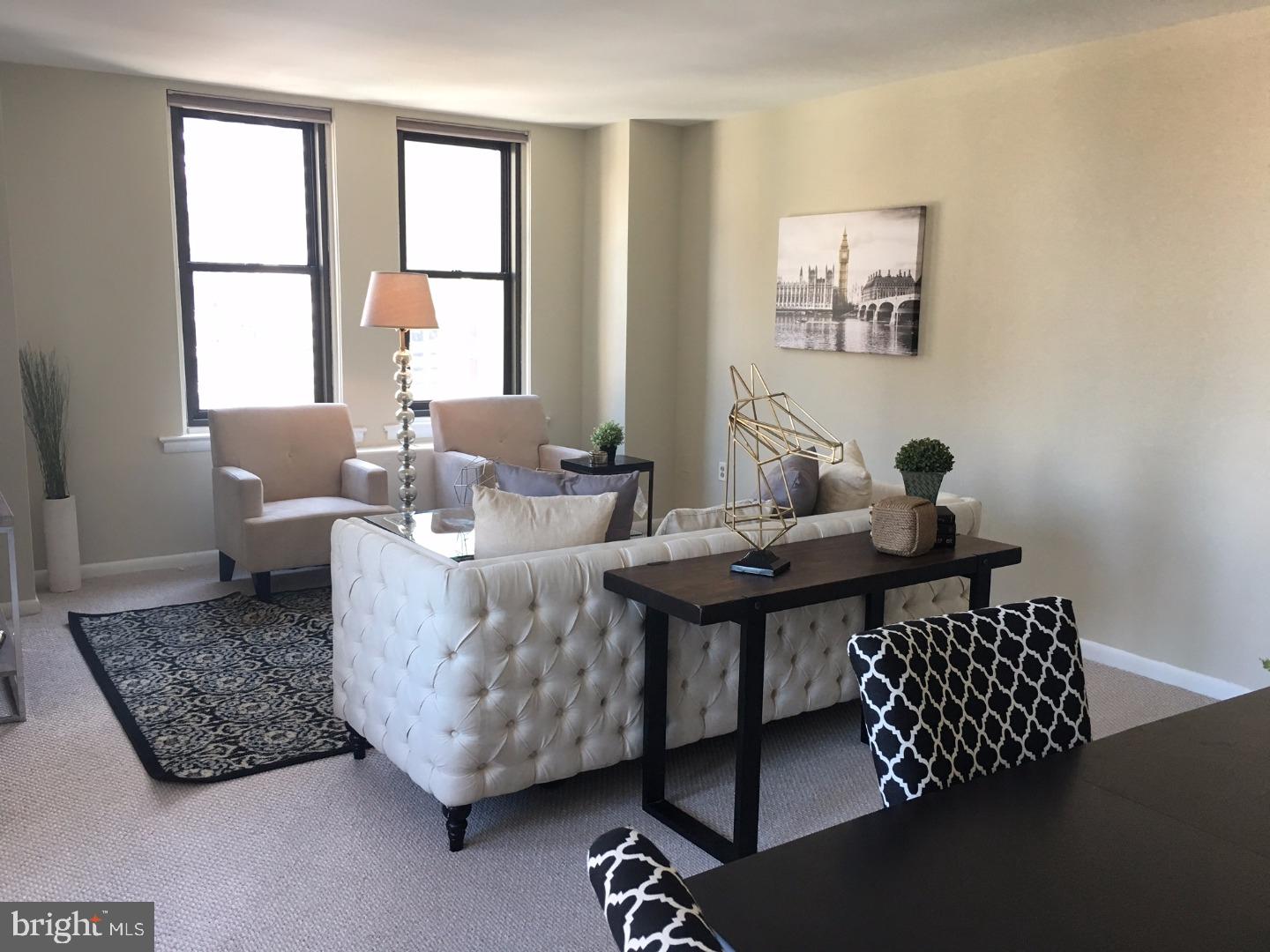 135 South 19th Street, Unit 804 Philadelphia, PA 19103 - Photo 4 of 18 a living room with furniture and window