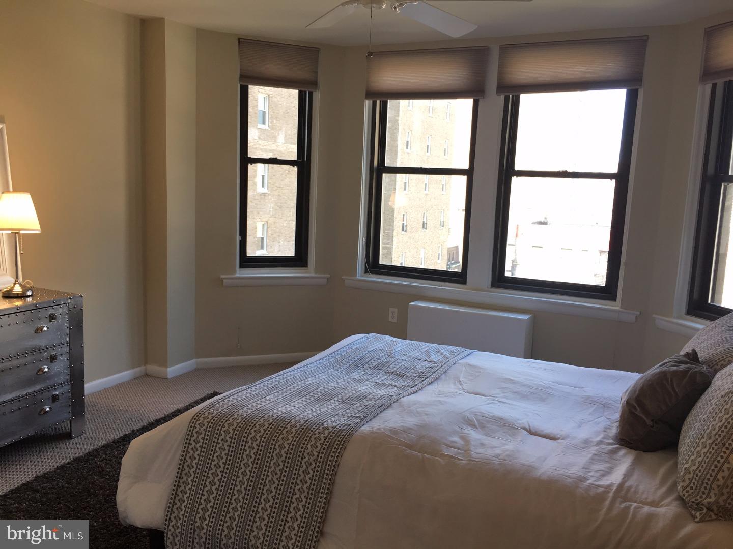 135 South 19th Street, Unit 804 Philadelphia, PA 19103 - Photo 9 of 18 a bedroom with a bed and a window