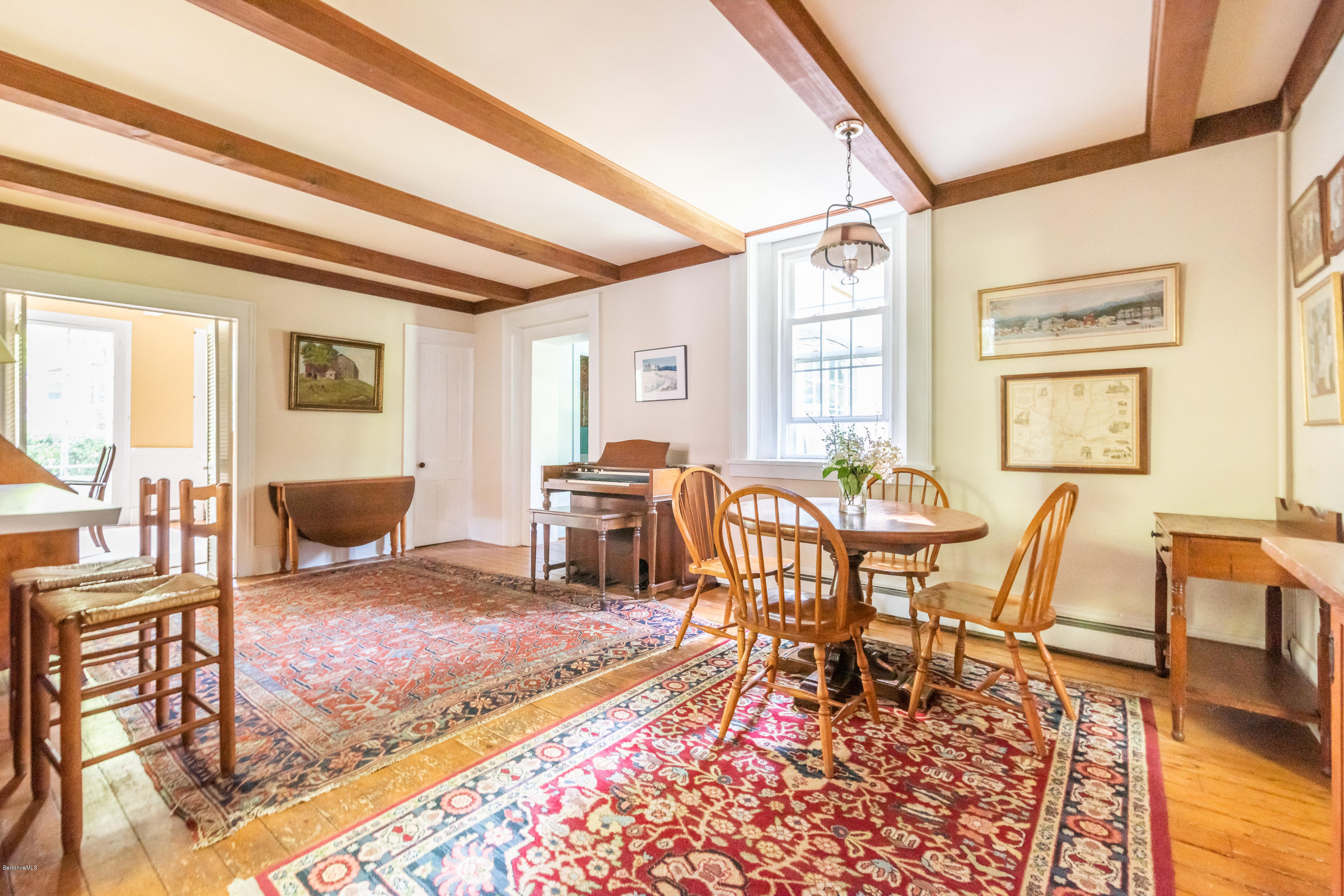 2 Christian Hill Road Stockbridge, MA 01229 - Photo 11 of 25 a living room with furniture a rug and a dining table