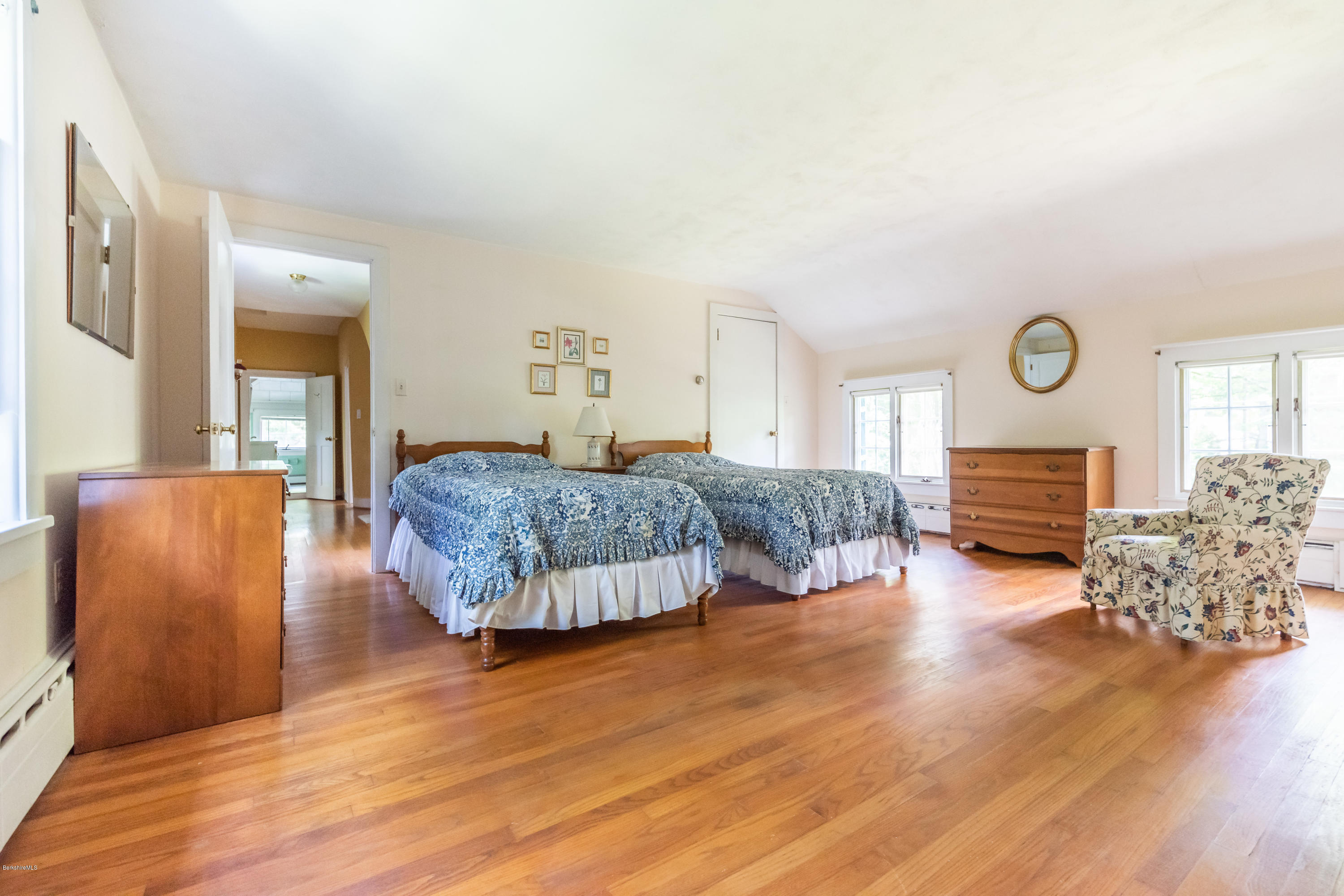 2 Christian Hill Road Stockbridge, MA 01229 - Photo 14 of 25 a bedroom with a bed and dresser with wooden floor