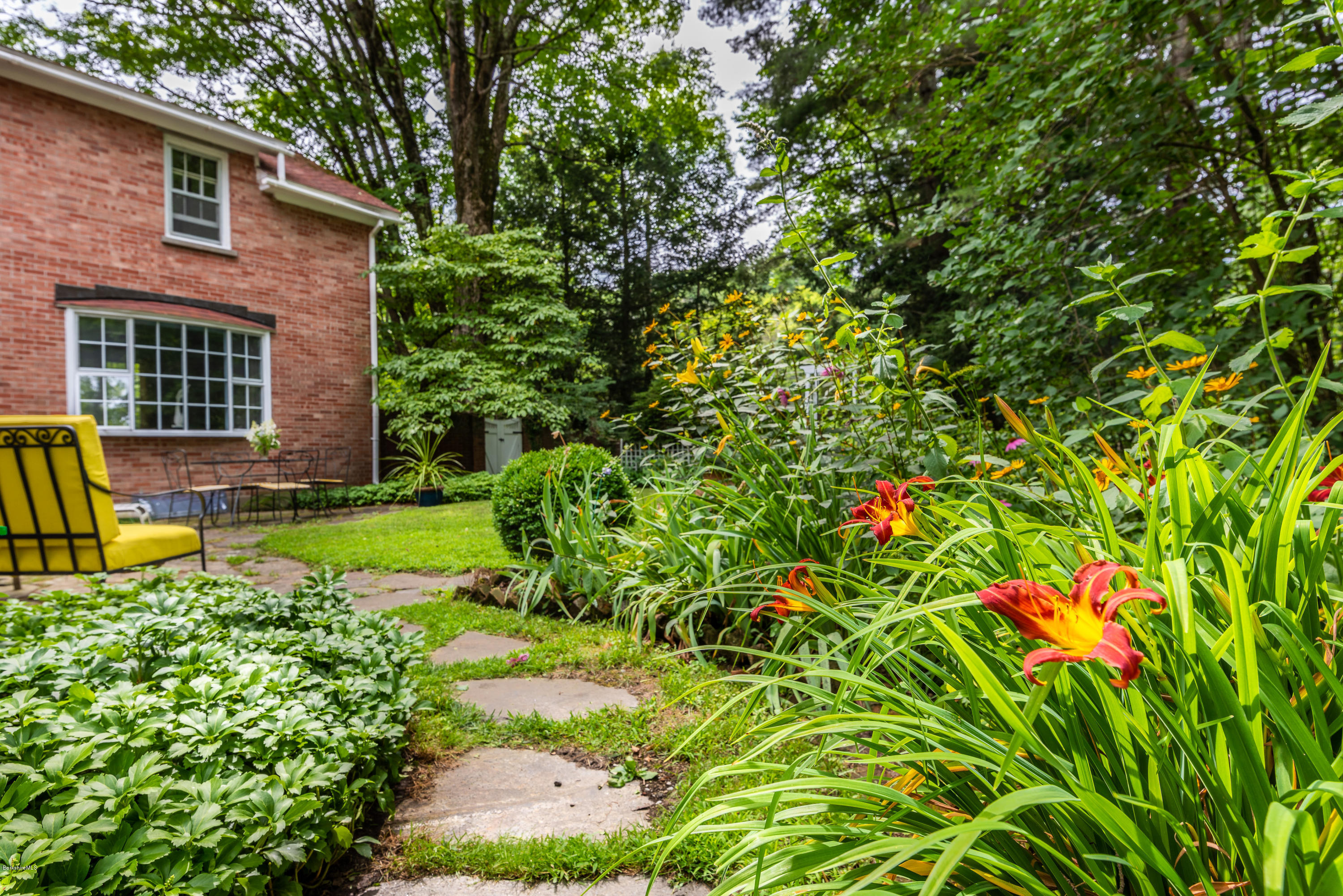 2 Christian Hill Road Stockbridge, MA 01229 - Photo 20 of 25 a view of a house with a small yard and plants