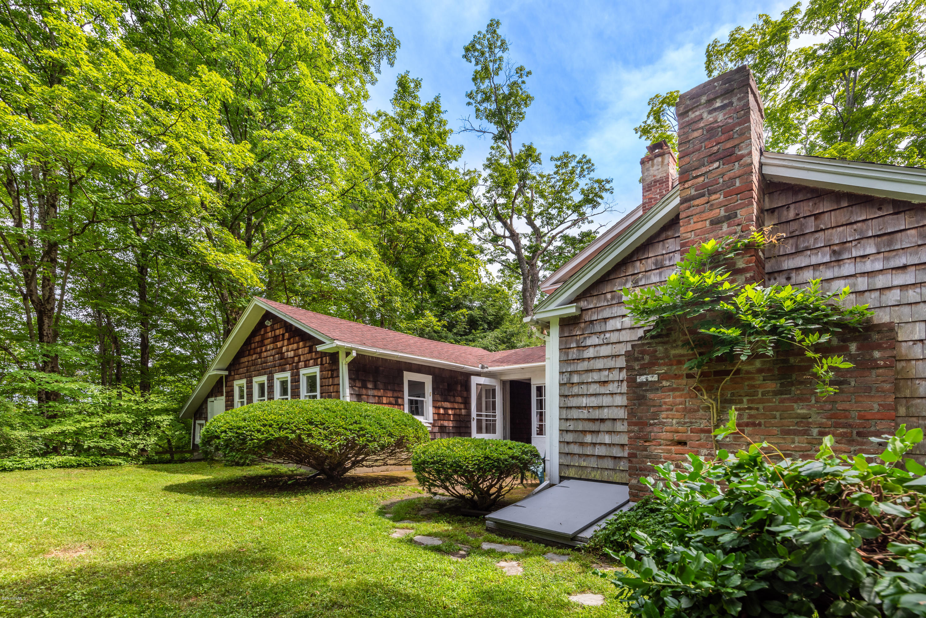 2 Christian Hill Road Stockbridge, MA 01229 - Photo 4 of 25 a front view of a house with garden