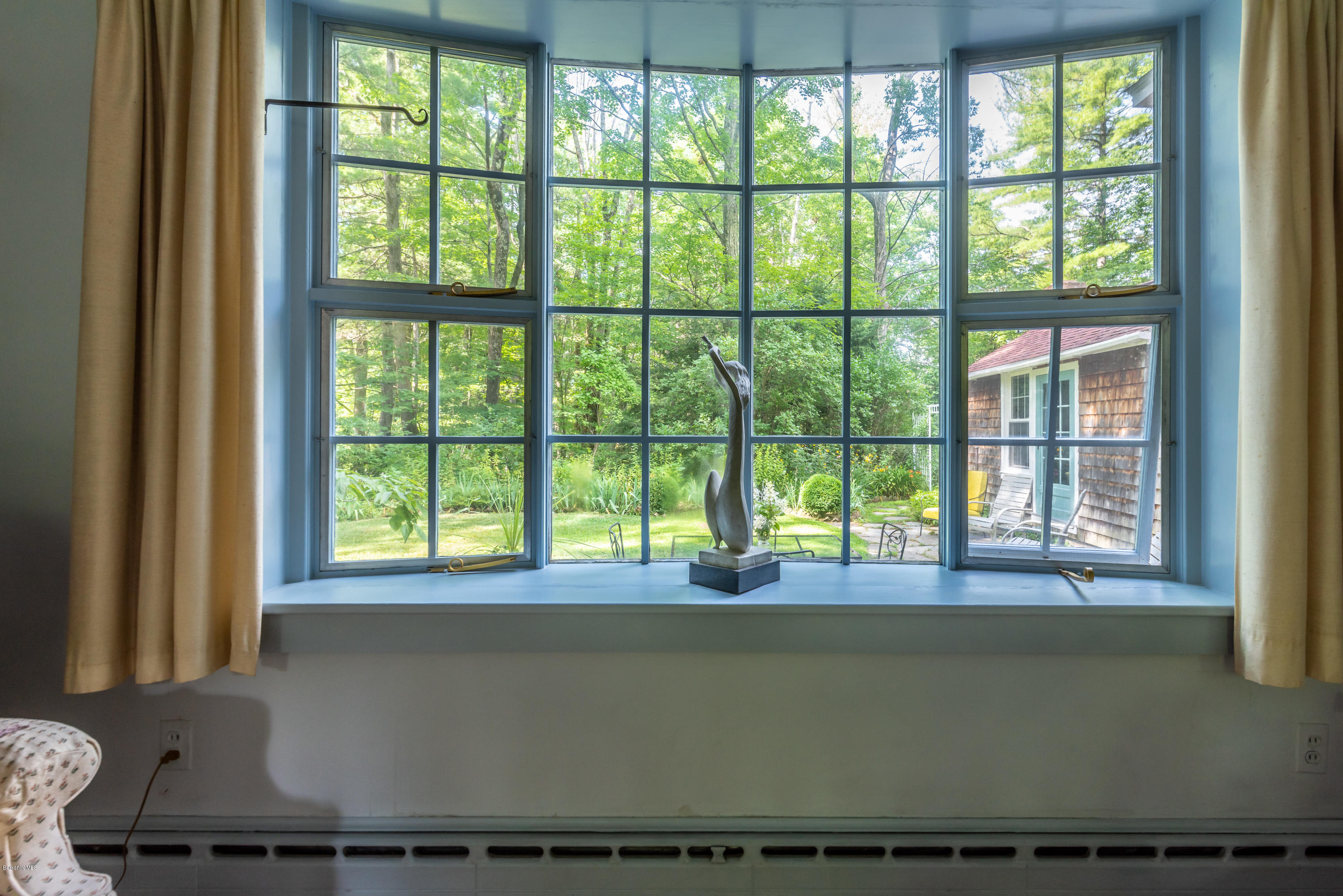 2 Christian Hill Road Stockbridge, MA 01229 - Photo 7 of 25 a living room with a large window and floor