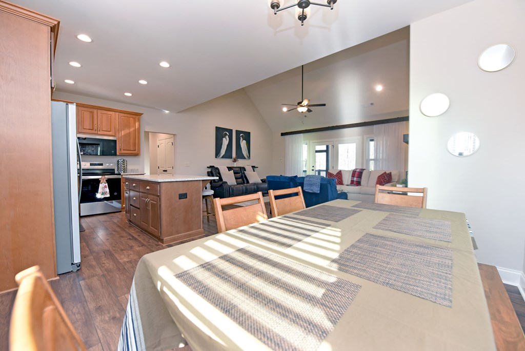 1008 Ridge Drive Morganton, GA 30560 - Photo 11 of 54 a large room with kitchen island a large counter top space a sink stainless steel appliances and cabinets