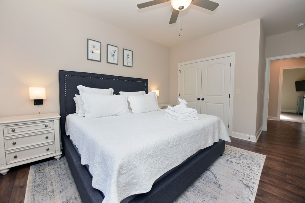 1008 Ridge Drive Morganton, GA 30560 - Photo 16 of 54 a bedroom with a bed and a chandelier