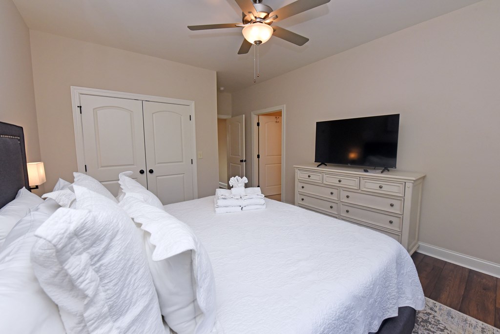 1008 Ridge Drive Morganton, GA 30560 - Photo 17 of 54 a bedroom with a bed and a flat tv screen on dresser