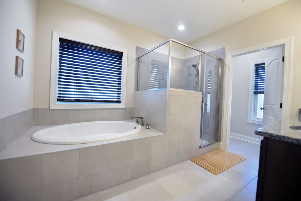 1008 Ridge Drive Morganton, GA 30560 - Photo 18 of 54 a bathroom with a bathtub and a sink