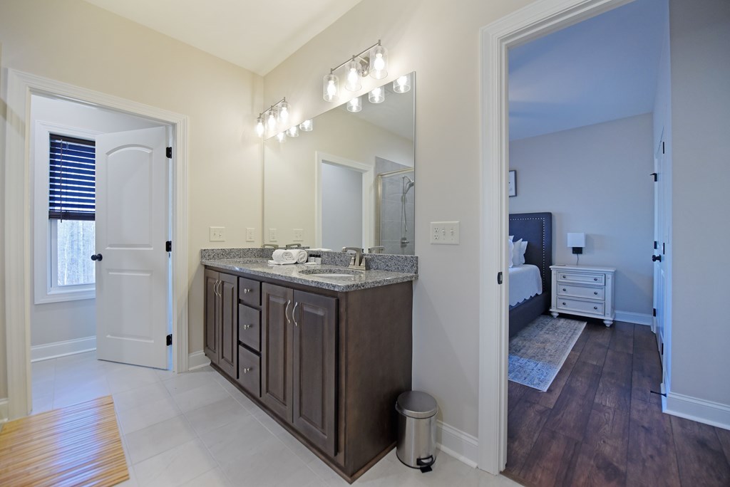 1008 Ridge Drive Morganton, GA 30560 - Photo 19 of 54 a bathroom with a sink a mirror and a toilet