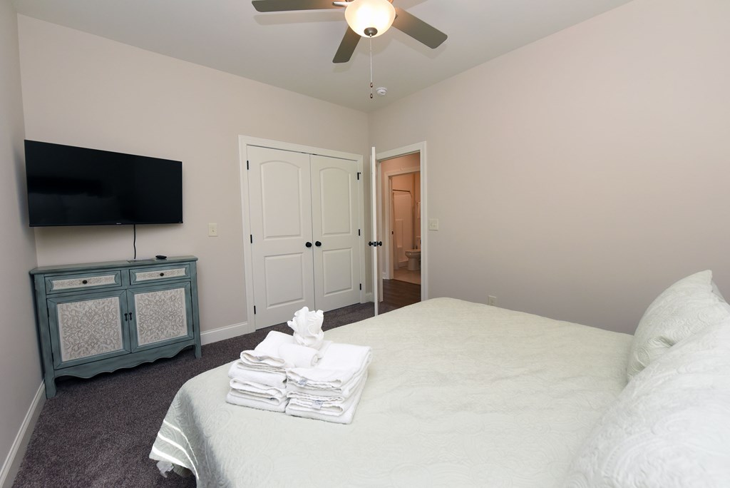 1008 Ridge Drive Morganton, GA 30560 - Photo 22 of 54 a bedroom with a bed and a flat screen tv