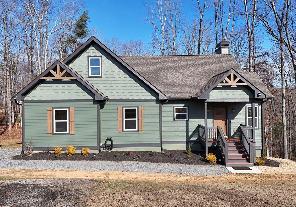 1008 Ridge Drive Morganton, GA 30560 - Photo 29 of 54 a view of a house with snow on the wall and a trees
