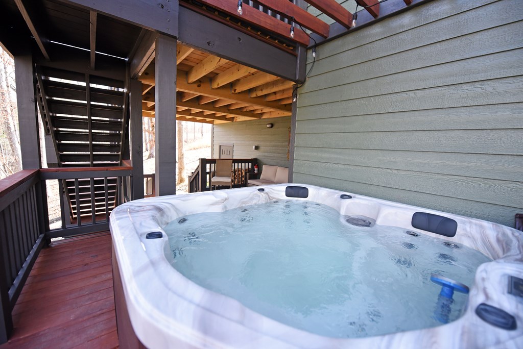 1008 Ridge Drive Morganton, GA 30560 - Photo 39 of 54 a bed sitting in a bedroom next to a window