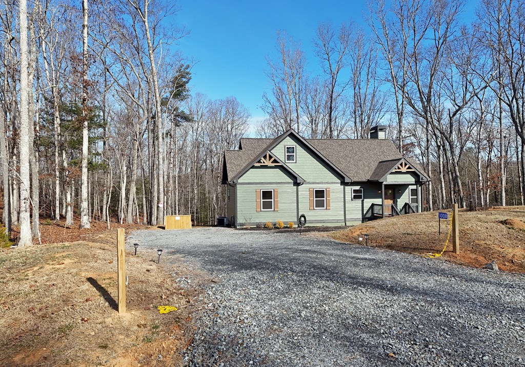 1008 Ridge Drive Morganton, GA 30560 - Photo 7 of 54 a white house that has a tree in front of it