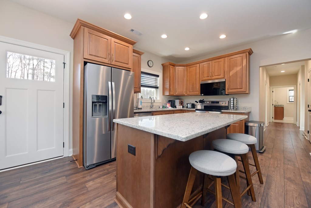 1008 Ridge Drive Morganton, GA 30560 - Photo 10 of 54 a kitchen with kitchen island a counter space a sink appliances and cabinets