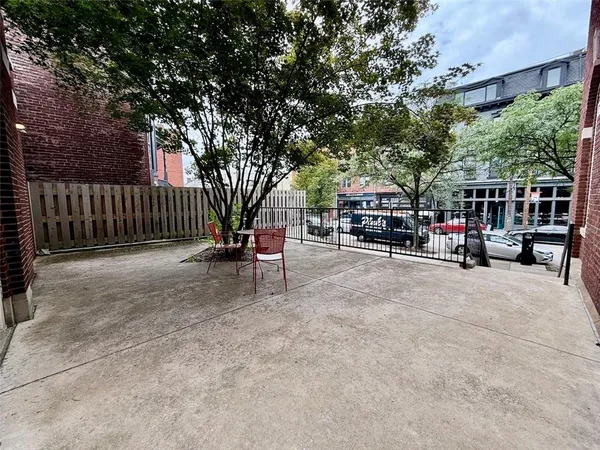 a view of a chairs and tables in the patio