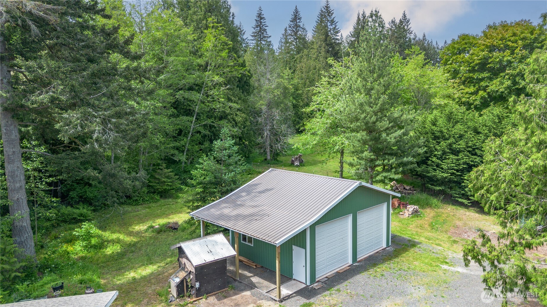 290 Werner Road Port Ludlow, WA 98365 - Photo 36 of 40 an aerial view of a house with a yard table and chairs