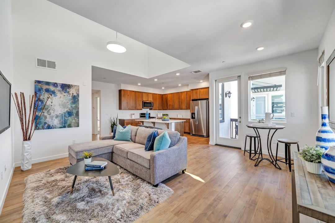 1421 Nightshade Road, Unit 40 Milpitas, CA 95035 - Photo 1 of 29 a living room with furniture and wooden floor