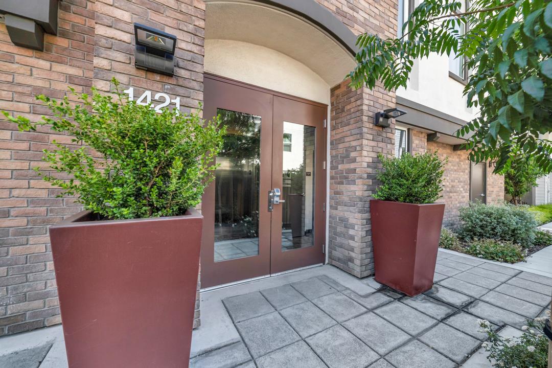 1421 Nightshade Road, Unit 40 Milpitas, CA 95035 - Photo 2 of 29 a view of a house with potted plants and a bench