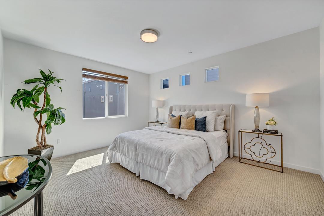 1421 Nightshade Road, Unit 40 Milpitas, CA 95035 - Photo 12 of 29 a bedroom with bed and a potted plant