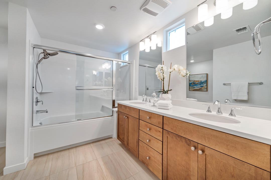 1421 Nightshade Road, Unit 40 Milpitas, CA 95035 - Photo 13 of 29 a bathroom with a tub sink shower and mirror