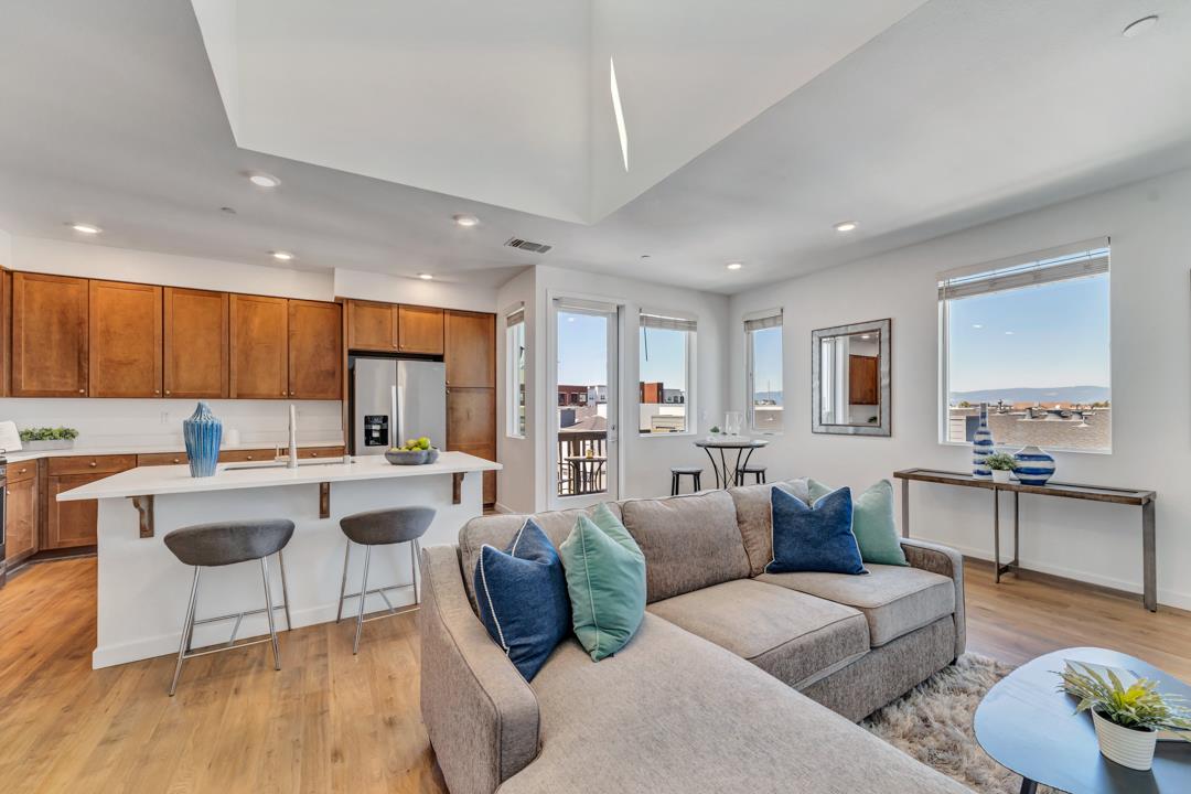1421 Nightshade Road, Unit 40 Milpitas, CA 95035 - Photo 3 of 29 a living room with furniture and a wooden floor