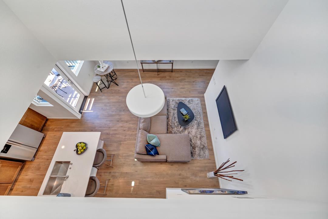 1421 Nightshade Road, Unit 40 Milpitas, CA 95035 - Photo 21 of 29 a living room with furniture and wooden floor
