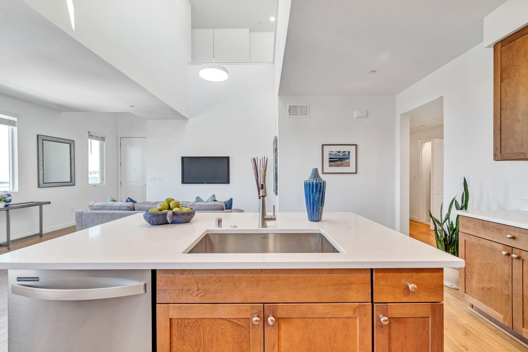 1421 Nightshade Road, Unit 40 Milpitas, CA 95035 - Photo 8 of 29 a kitchen with a sink and a refrigerator