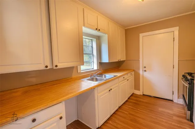 a room with a sink and a window