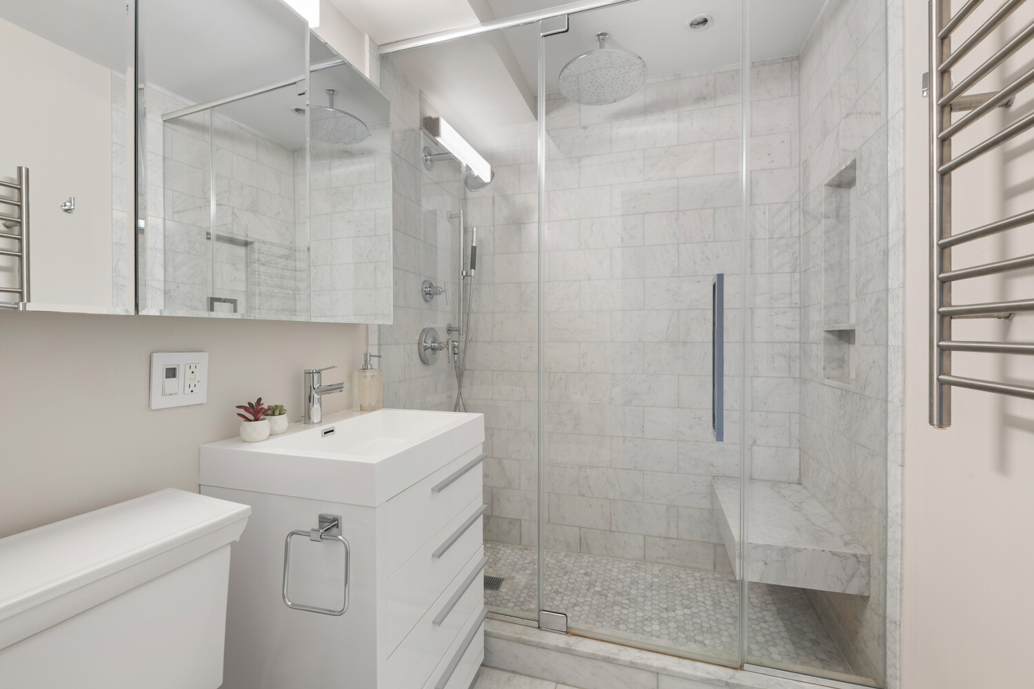 196 East 75th Street, Unit 16E Manhattan, NY 10021 - Photo 10 of 13 a bathroom with a sink toilet and shower