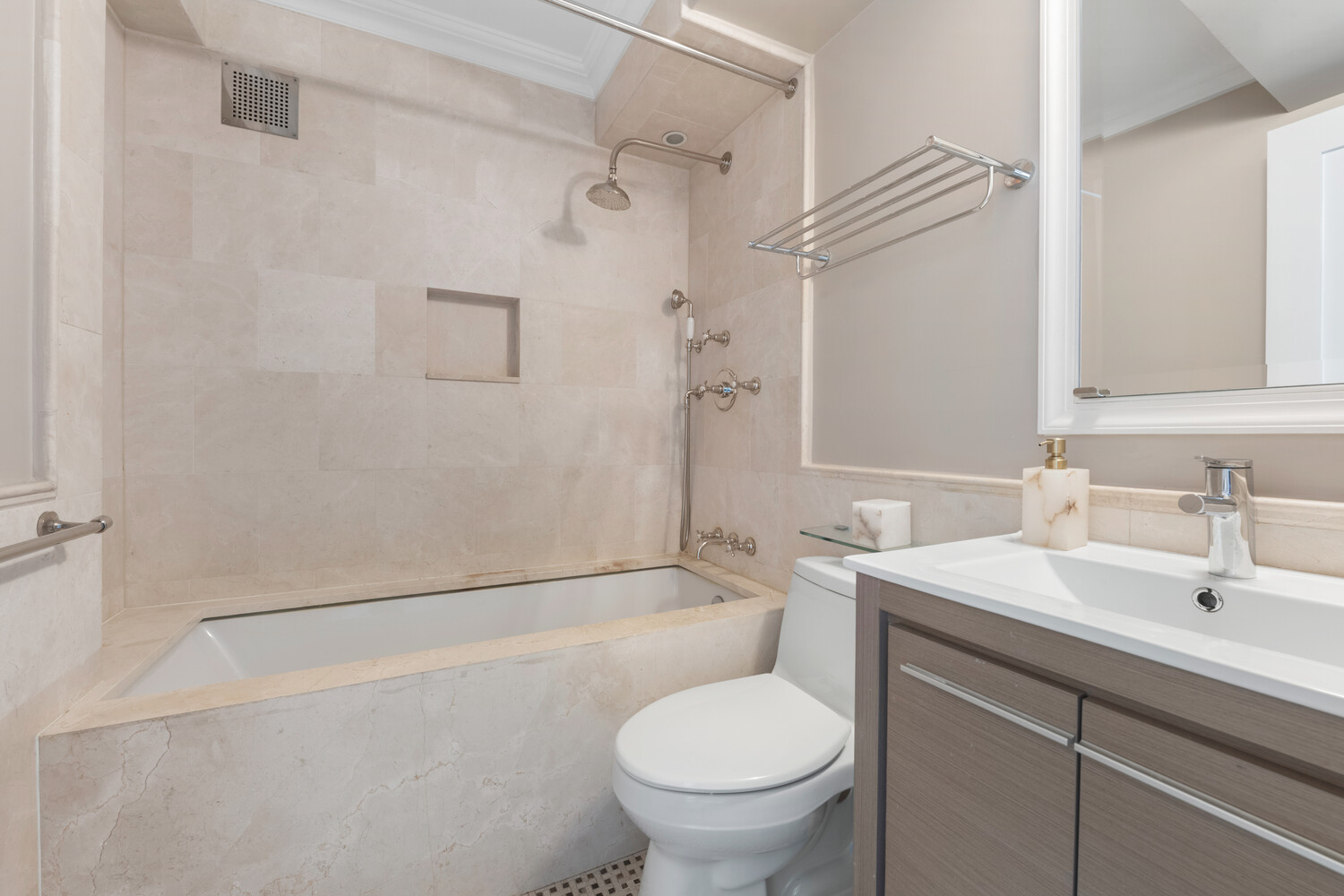 196 East 75th Street, Unit 16E Manhattan, NY 10021 - Photo 12 of 13 a bathroom with a sink toilet and shower