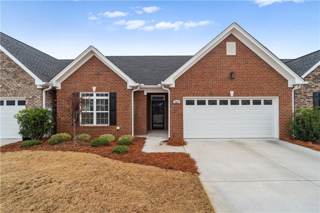204 Patriots Row Southwest Calhoun, GA 30701 - Photo 1 of 1 a front view of a house with a yard and garage