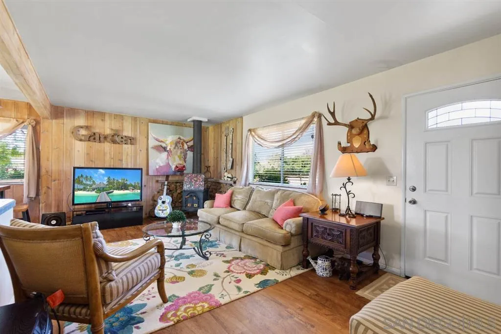 Encinitas, CA 92024 - Photo 9 of 12 a living room with furniture and a flat screen tv