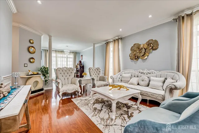a living room with furniture and kitchen view