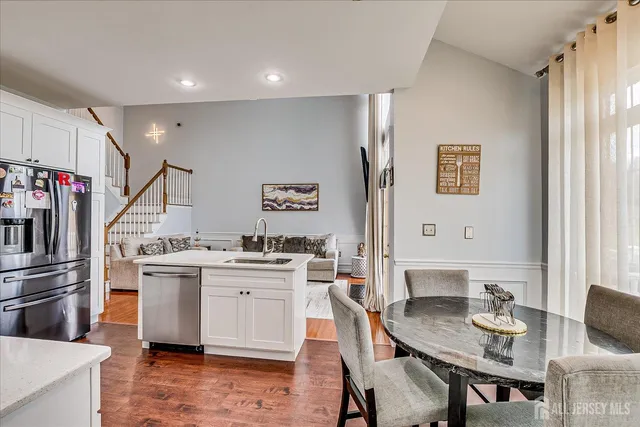 a bathroom with a double vanity sink mirror and shower