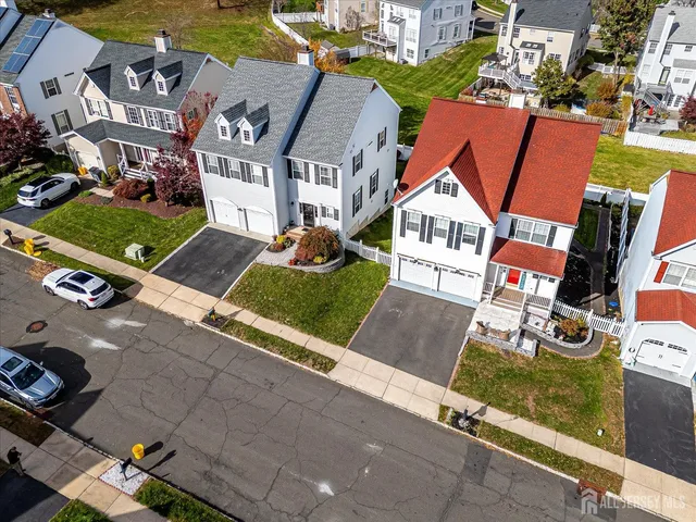 a view of a hallway with wooden floor and glass door