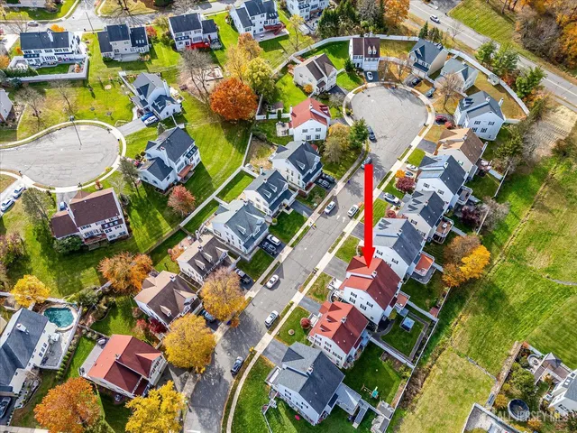 a living room with furniture and a large mirror