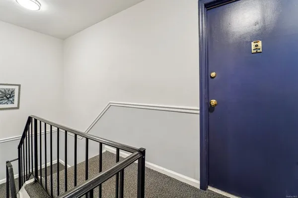 a view of an empty room with windows