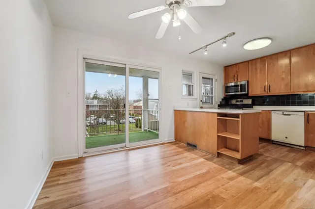 a view of kitchen with microwave and stove
