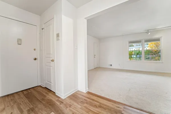 a view of an empty room with a window