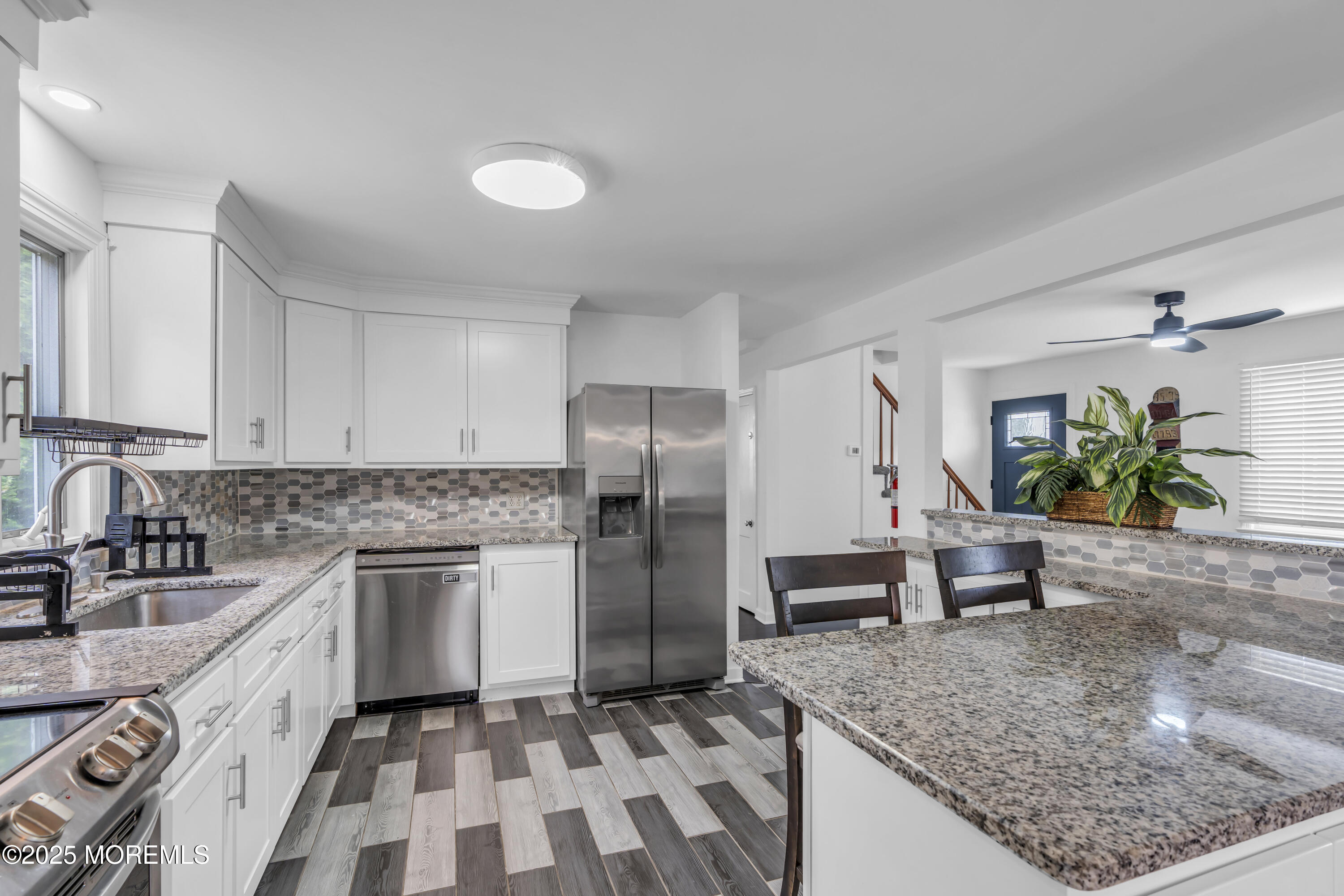 2 Schiverea Avenue Freehold, NJ 07728 - Photo 11 of 36 a kitchen with stainless steel appliances granite countertop a sink stove and refrigerator