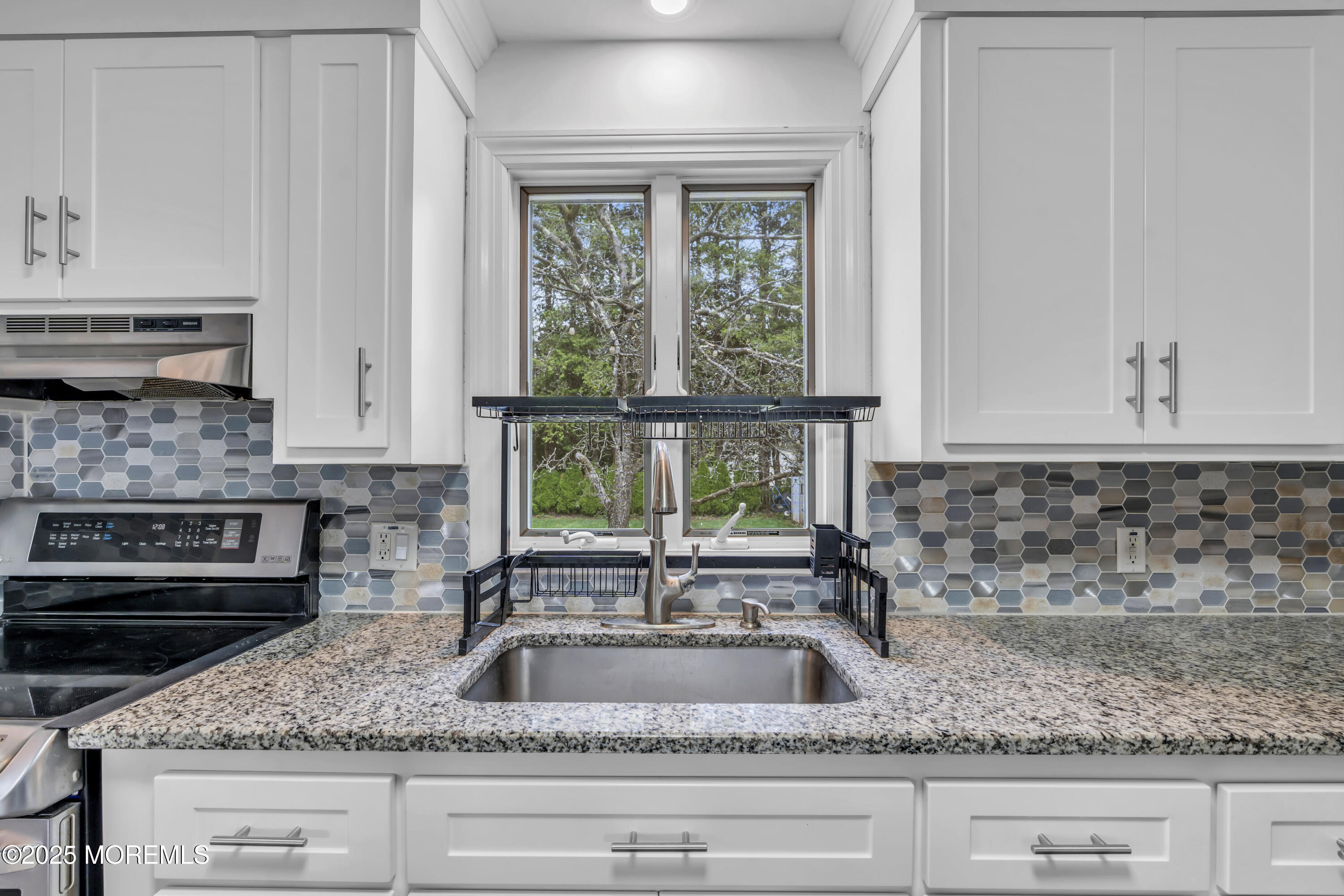 2 Schiverea Avenue Freehold, NJ 07728 - Photo 12 of 36 a kitchen with sink a window and appliances