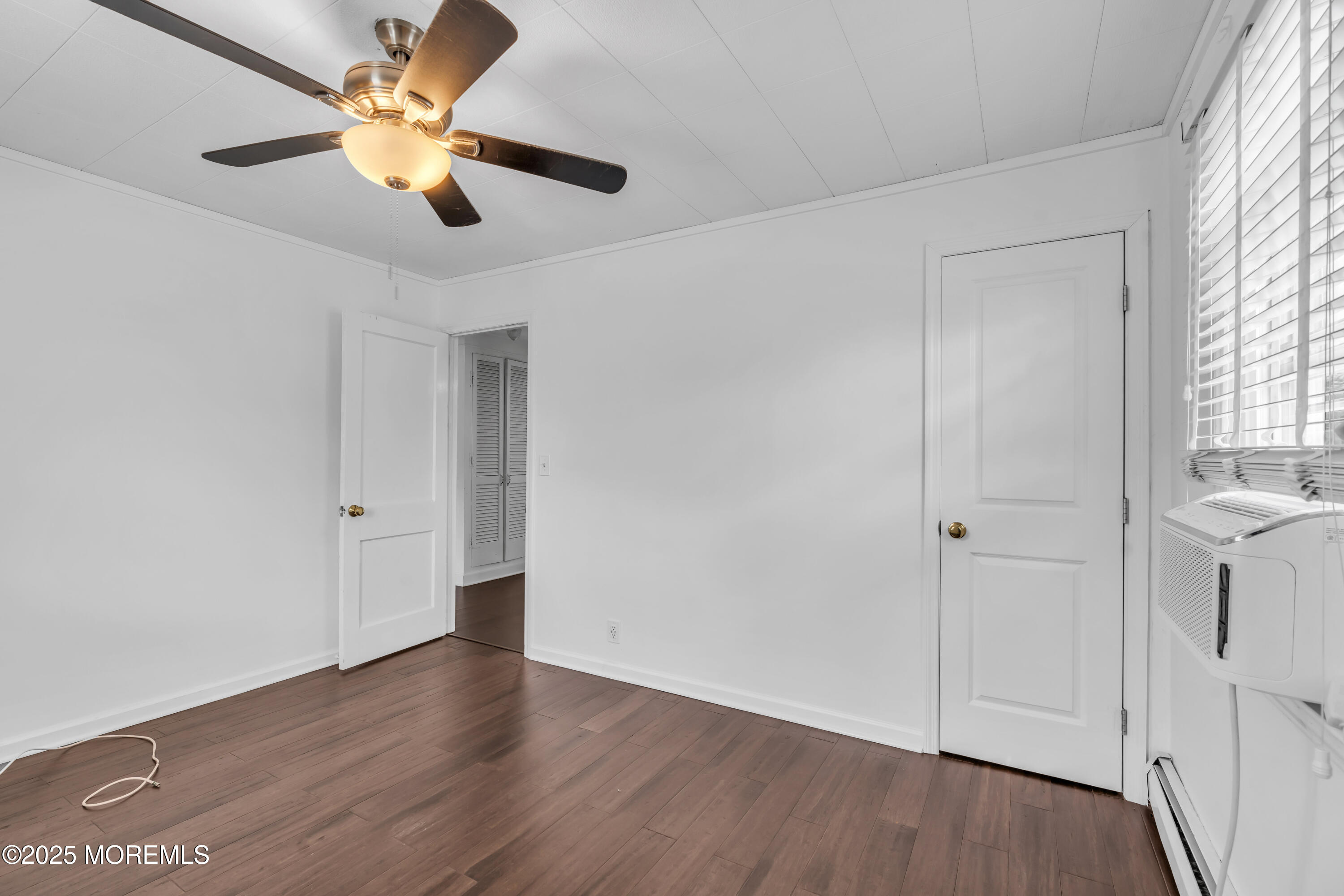 2 Schiverea Avenue Freehold, NJ 07728 - Photo 18 of 36 wooden floor in an empty room with a window
