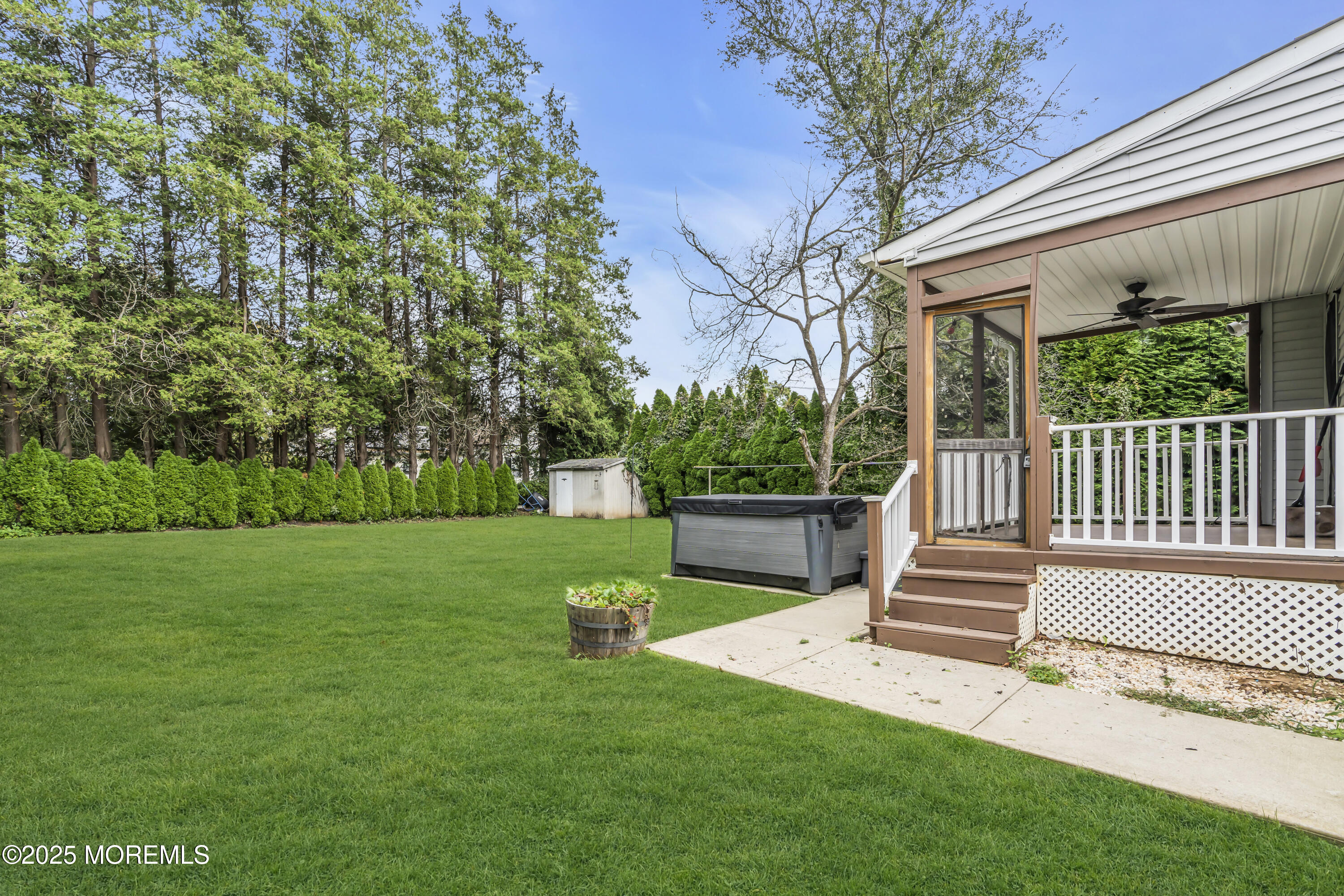 2 Schiverea Avenue Freehold, NJ 07728 - Photo 33 of 36 a view of a white house with a big yard potted plants and large tree