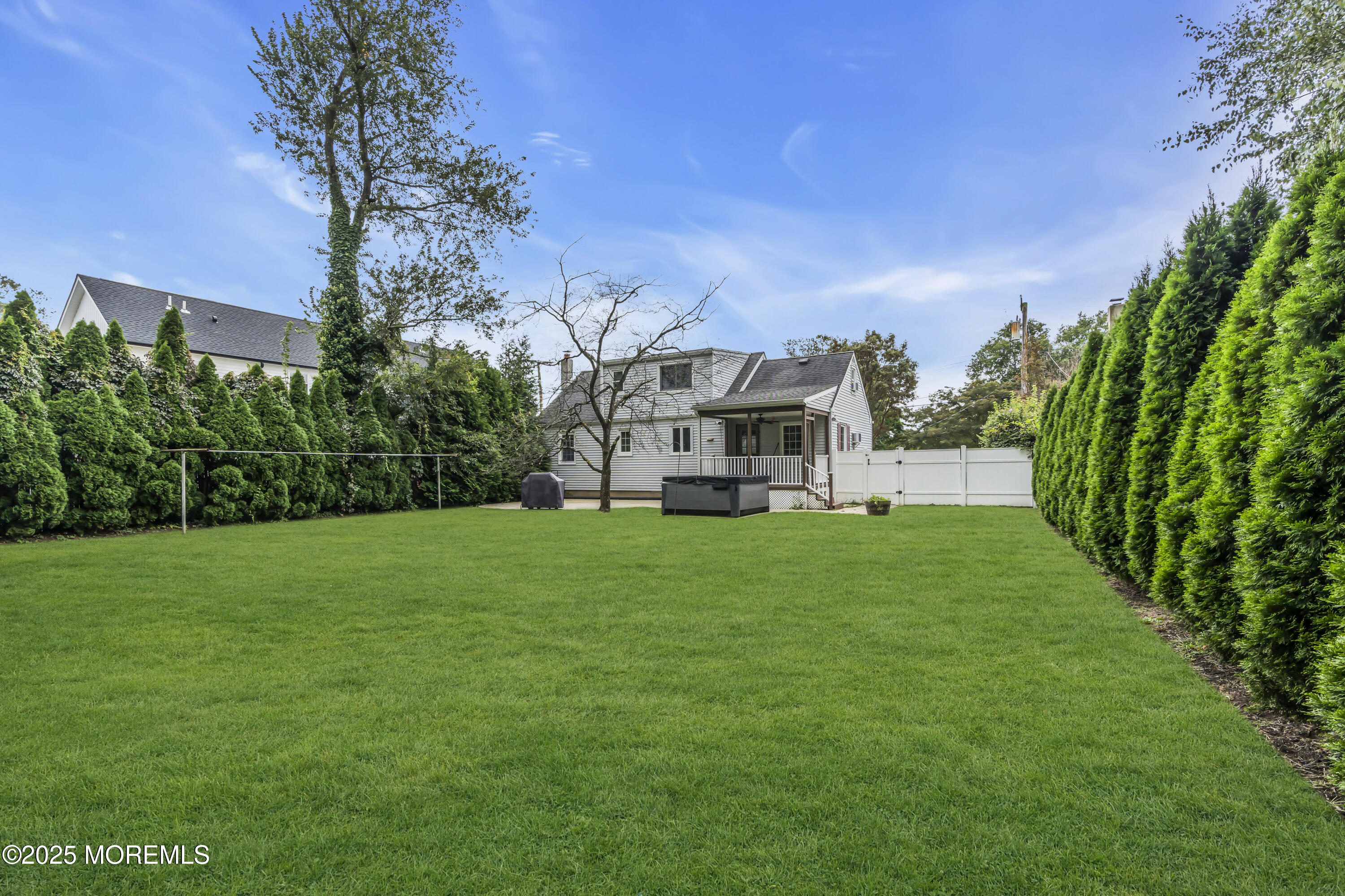 2 Schiverea Avenue Freehold, NJ 07728 - Photo 35 of 36 a view of a white house with a big yard and large trees